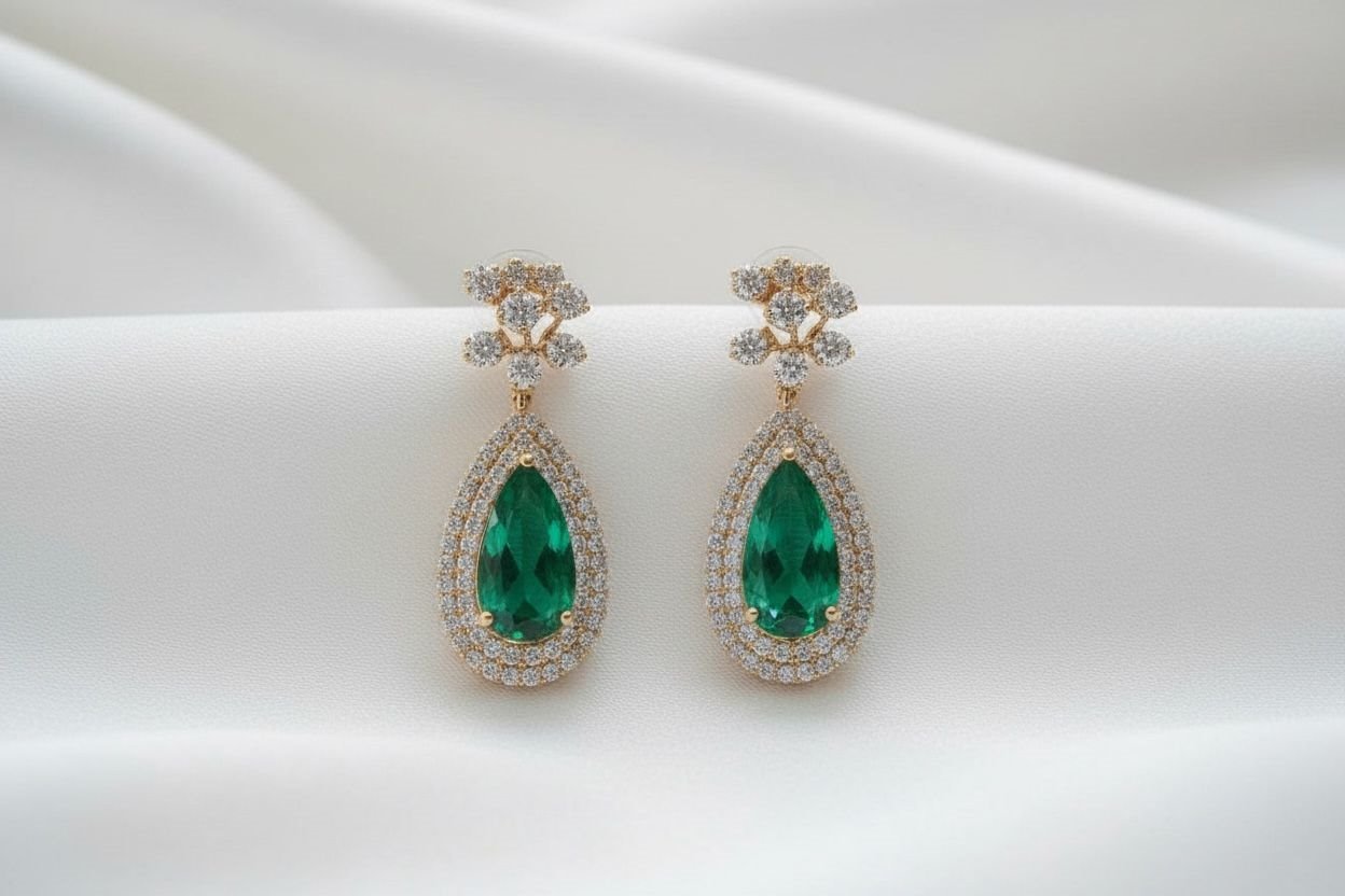 Emerald drops, framed in light.